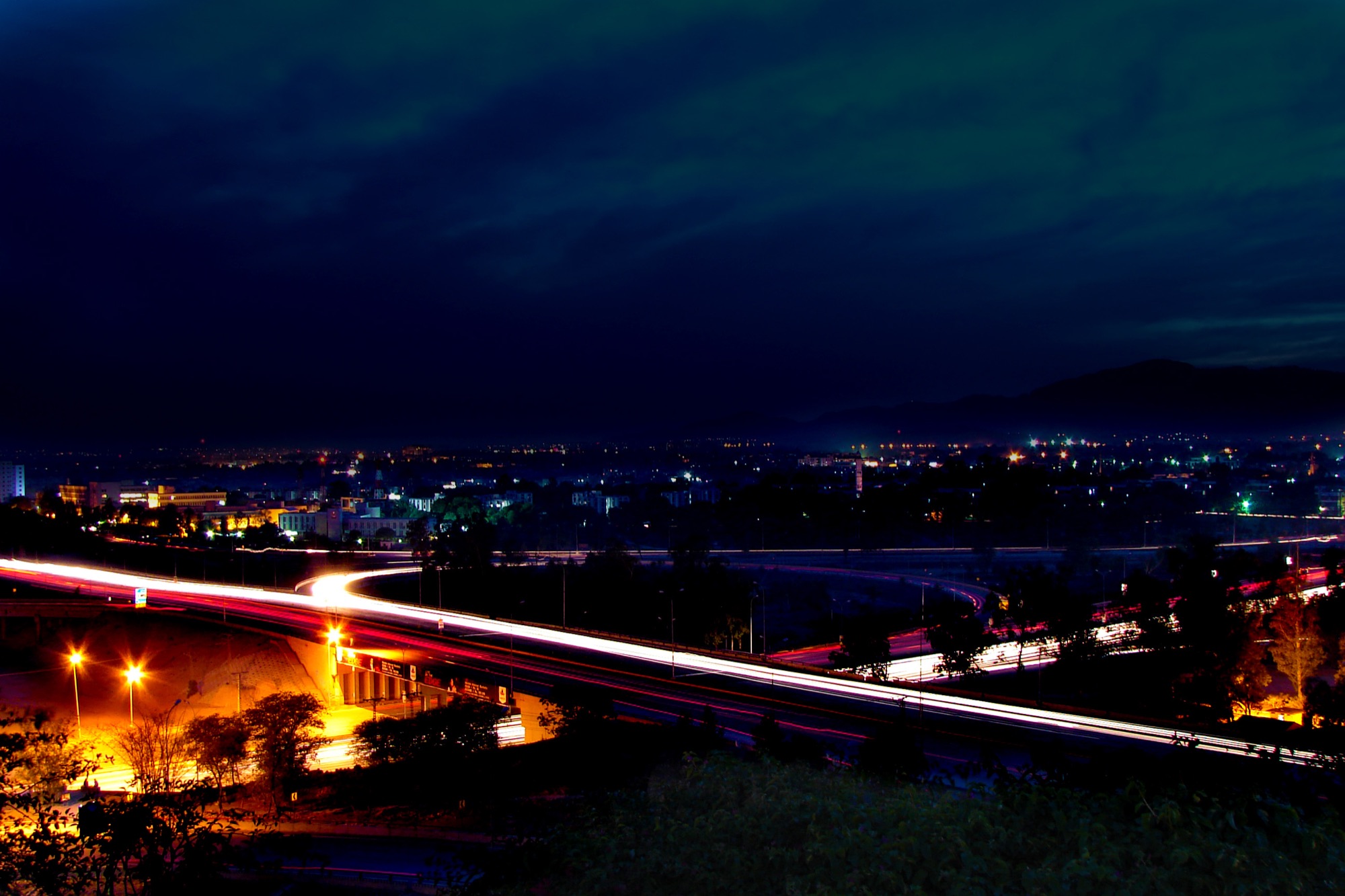 Islamabad at night, traffic trails across the city