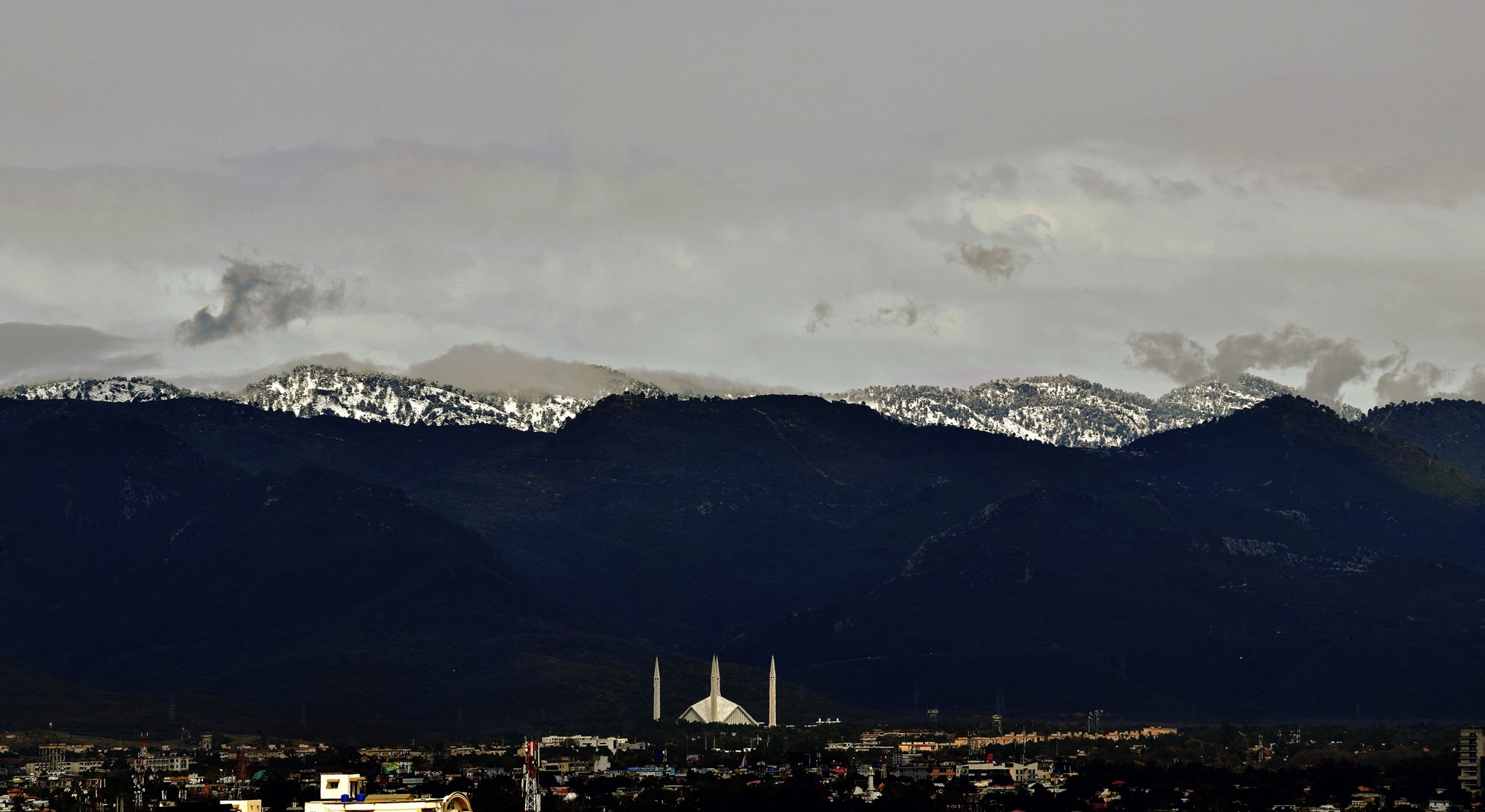 Faisal Mosque beneath the snow-capped Margalla Hills, Islamabad