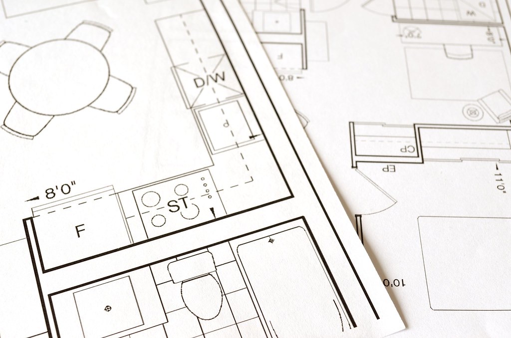 Architectural floor plans on a table